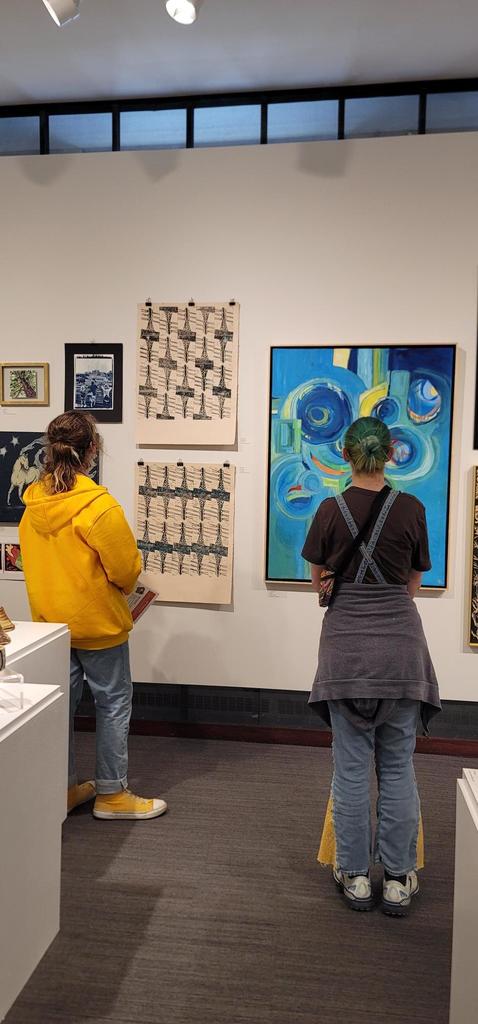 Raini LaBrosse and Rice Johnson are enjoying the artwork at the Washington Pavillion during the Art Club Field trip!