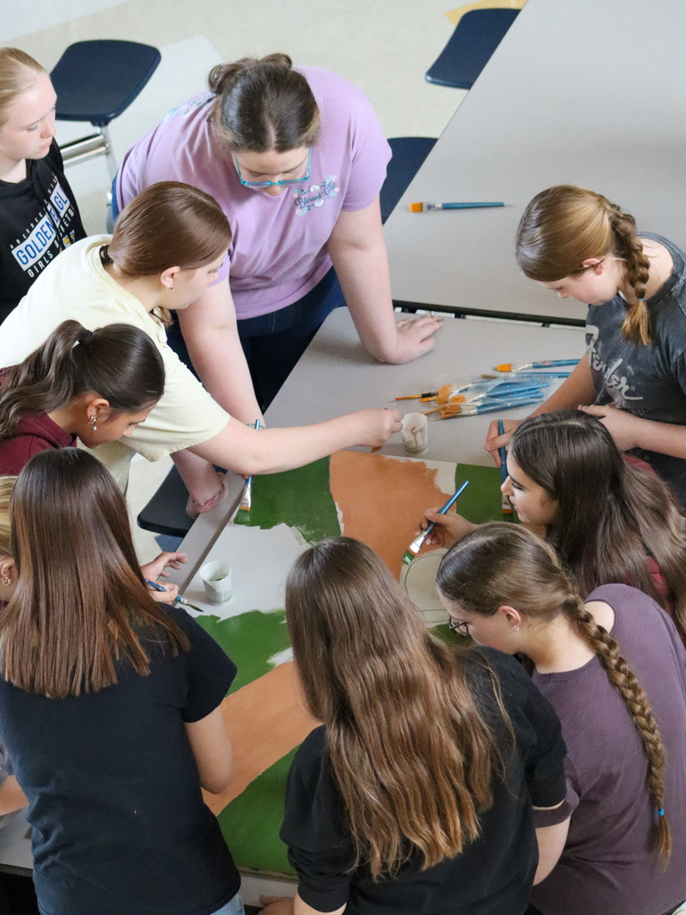 SMS students painting a mural