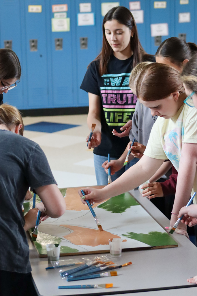 SMS students painting a mural