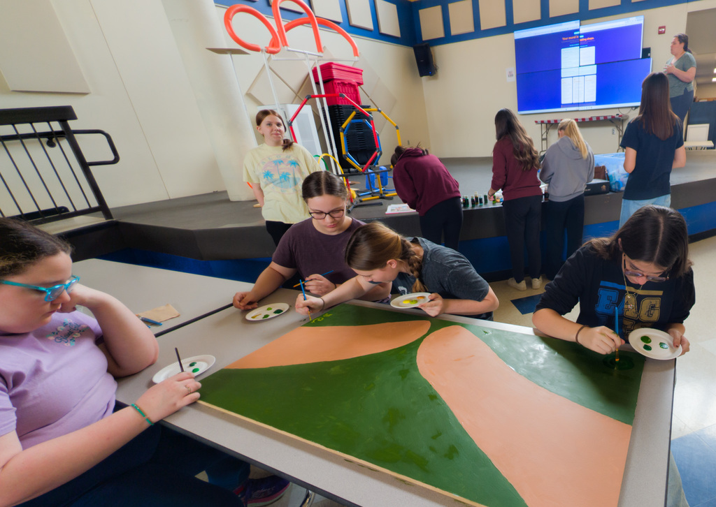 SMS students painting a mural
