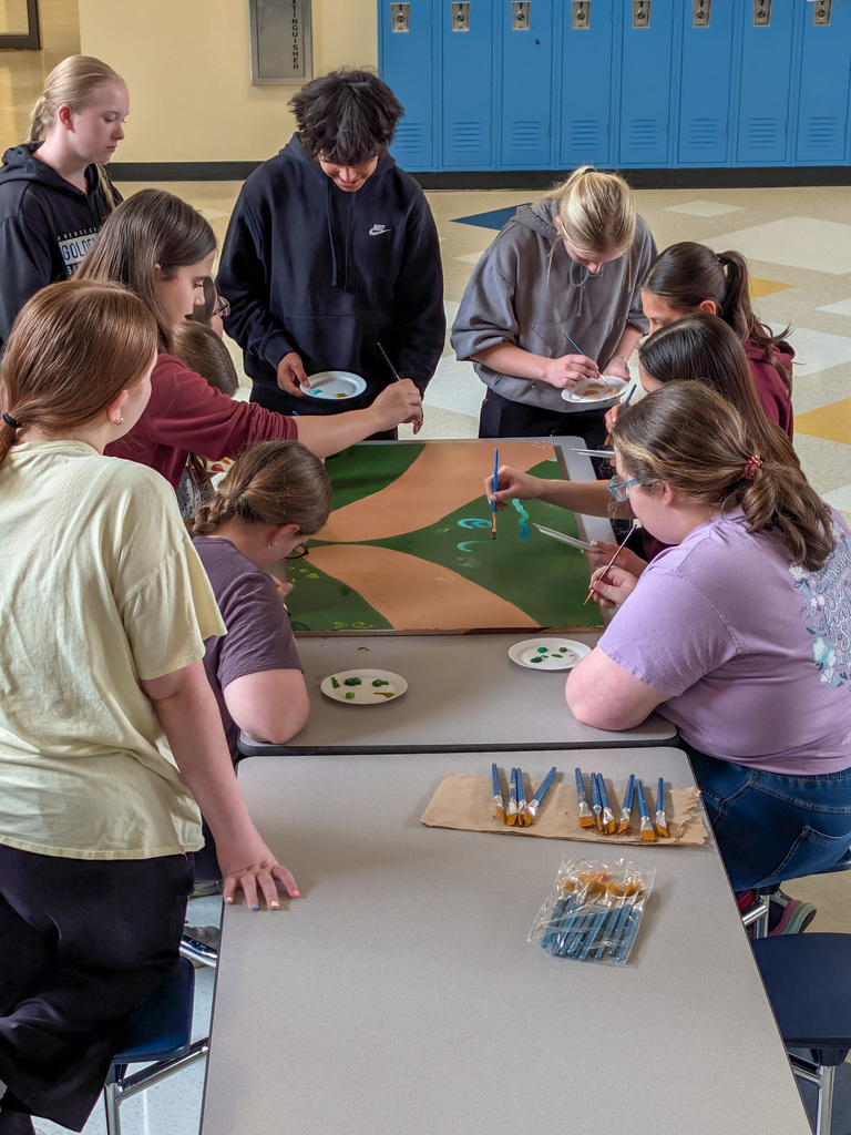 SMS students painting a mural