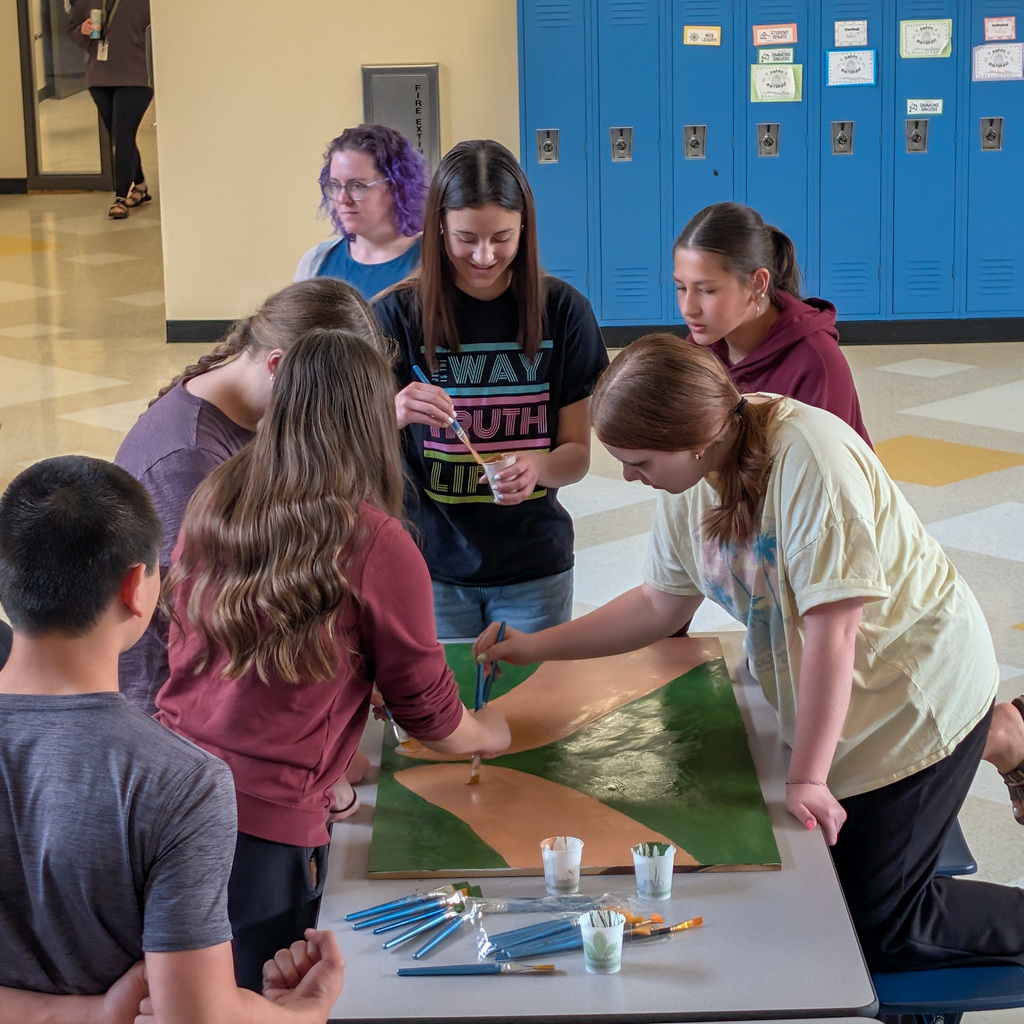 SMS students painting a mural