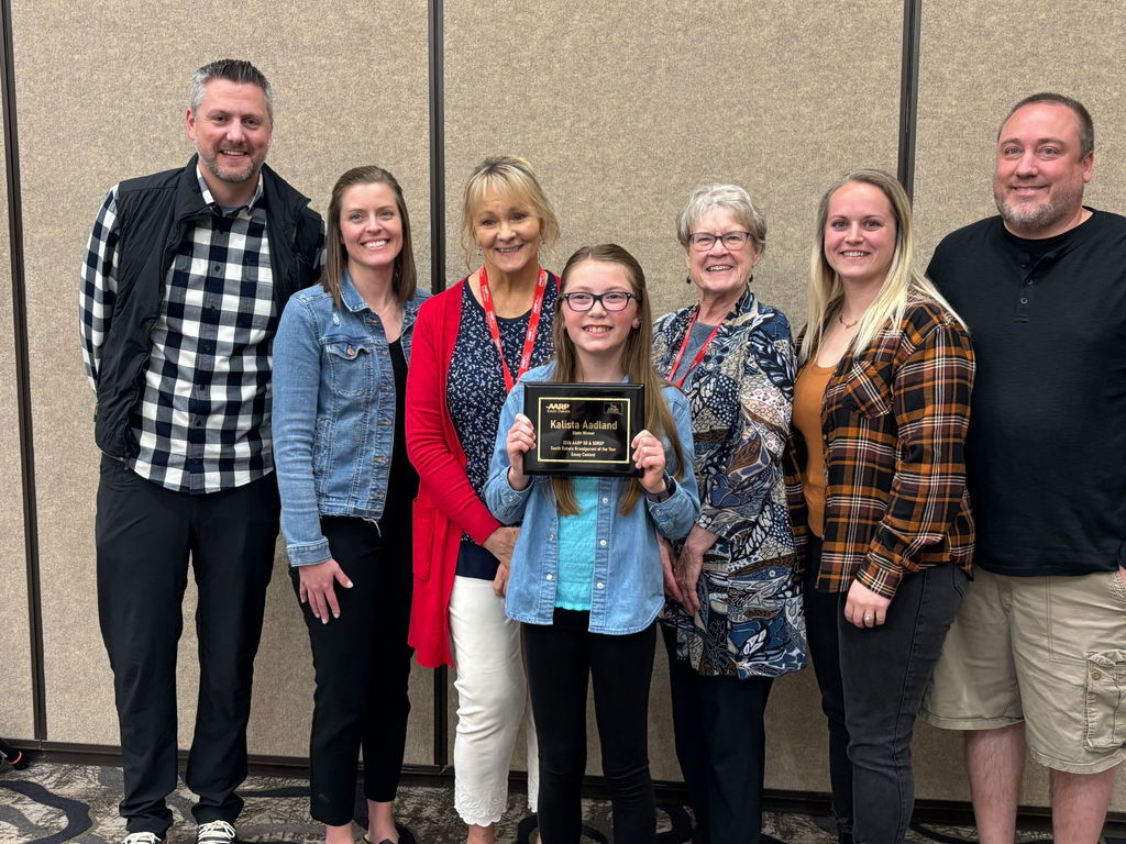 Kalista Aadland with her family, Gayle Bortnem, and contest chair