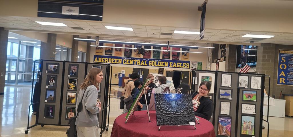 Here,  some are exploring the art made by their fellow talented students!