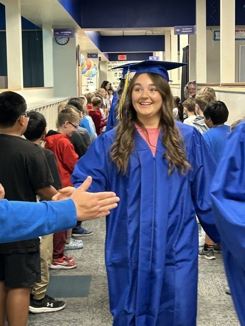 CHS senior walking through Lincoln Elementary