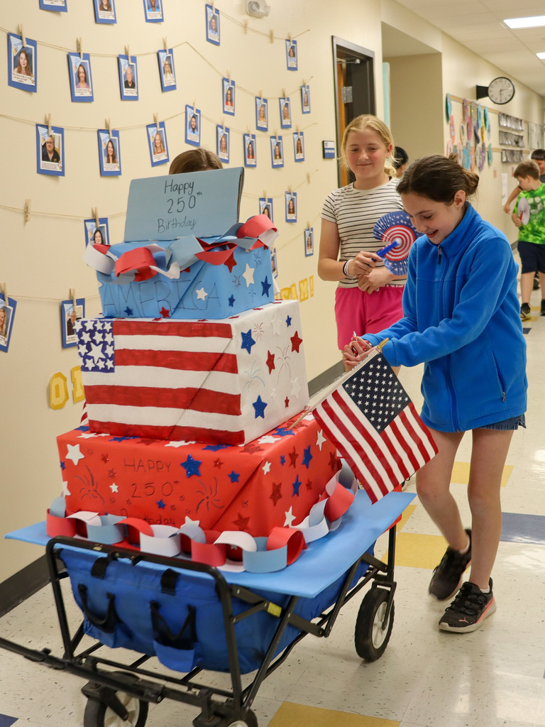 Mike Miller students pushing a patriotic float in their parade