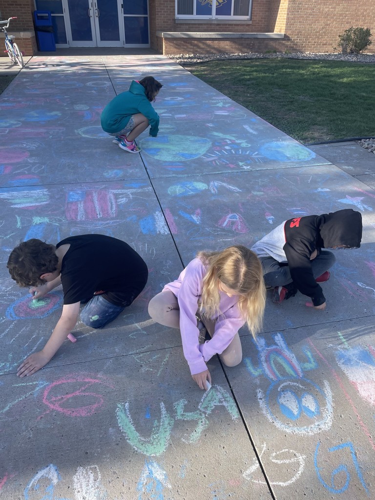 May Overby students making patriotic sidewalk chalk art