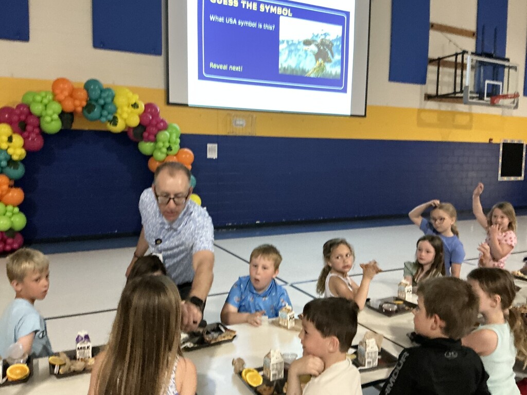 C.C. Lee students playing a guess the landmark game with Mr. Osborn