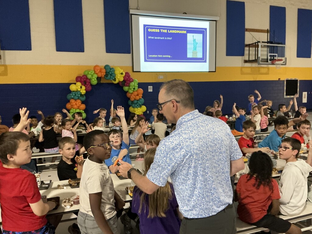C.C. Lee students playing a guess the landmark game with Mr. Osborn