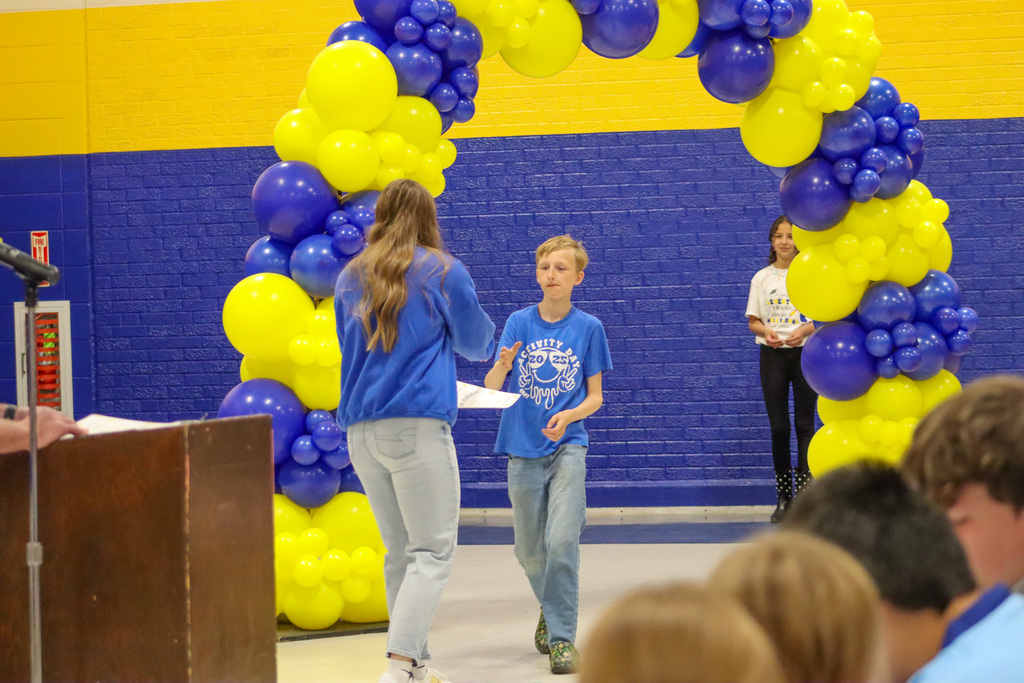 OMT 5th grader getting his certificate from Mrs. Hulscher at the graduation ceremony