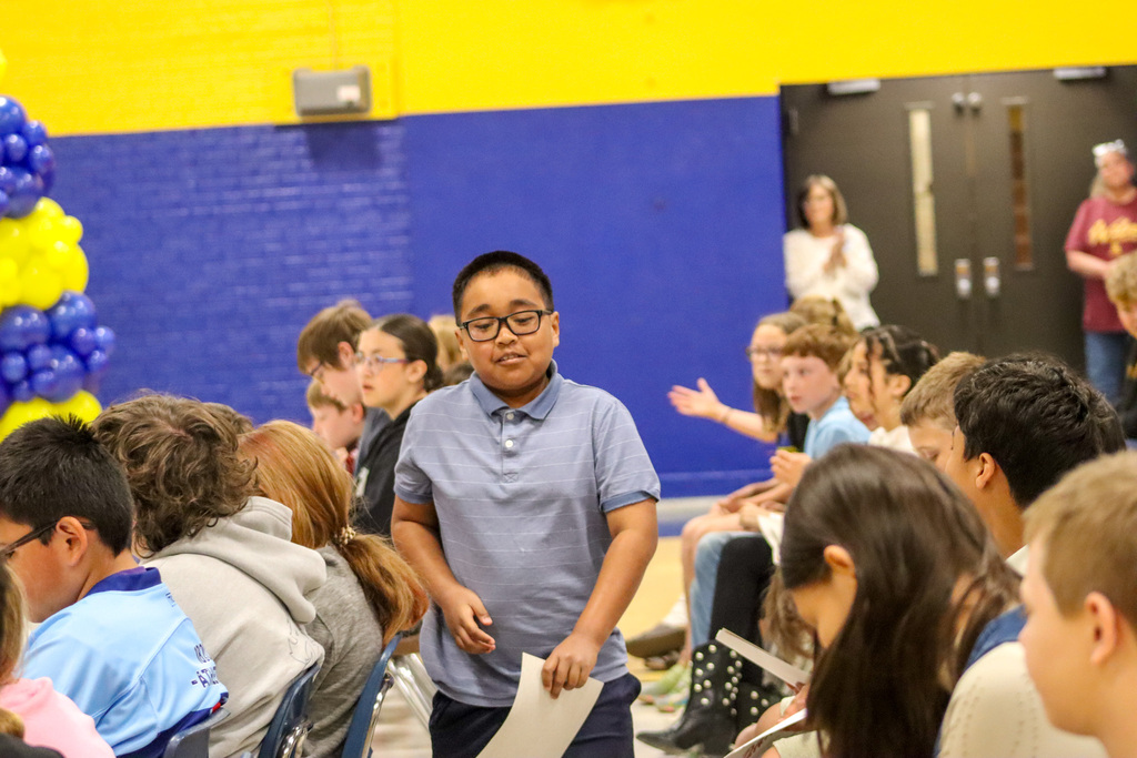 OMT 5th grader at graduation ceremony