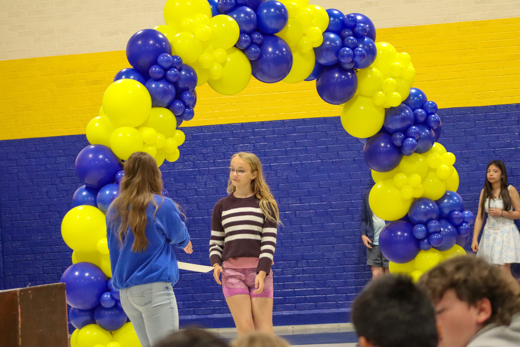 OMT 5th grader getting her certificate from Mrs. Hulscher at the graduation ceremony