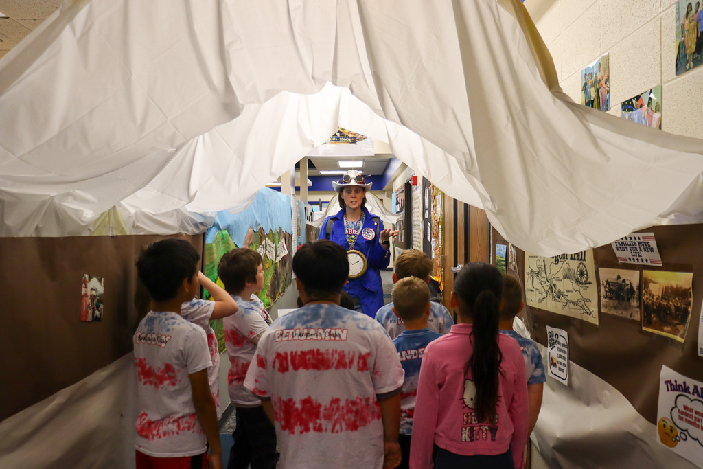 Mrs. Scheel leading students on a patriotic tour