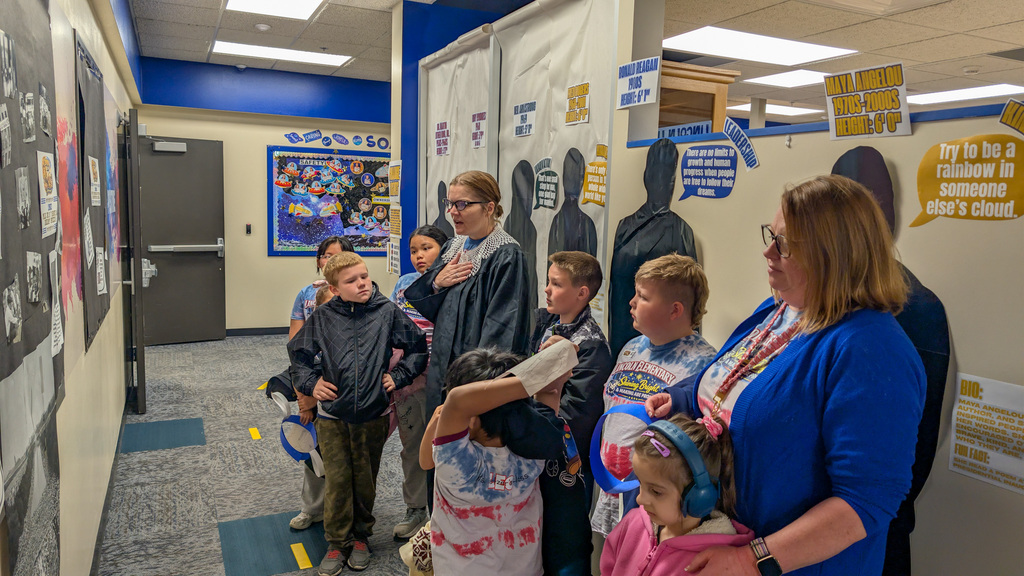 Mrs. Gatzemeyer leading students on a patriotic tour