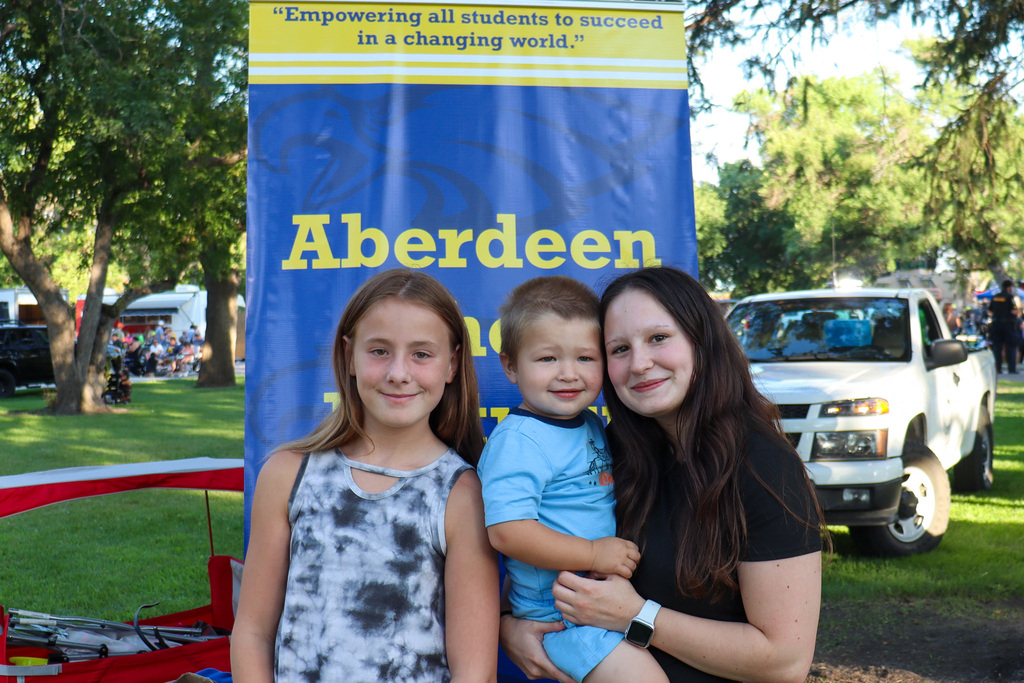 A family posing for a photo at National Night Out