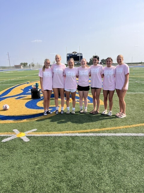 CHS Girls Soccer players wearing the pink T-shirts from their youth soccer camp
