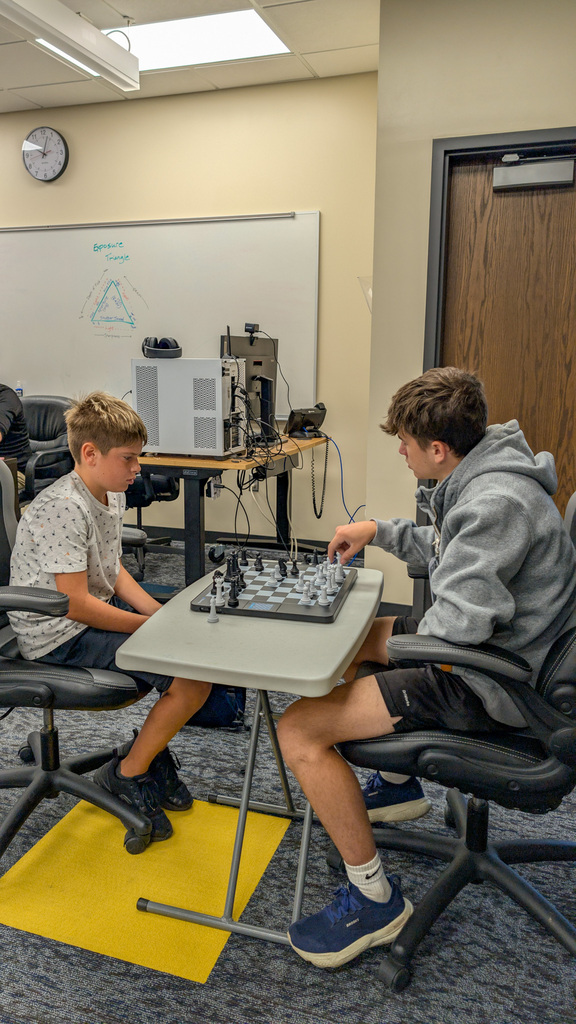 Students playing chess at the Esports Day Camp