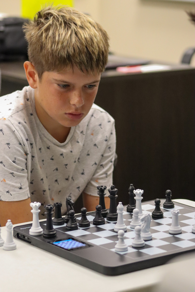 Student playing chess at the Esports Day Camp