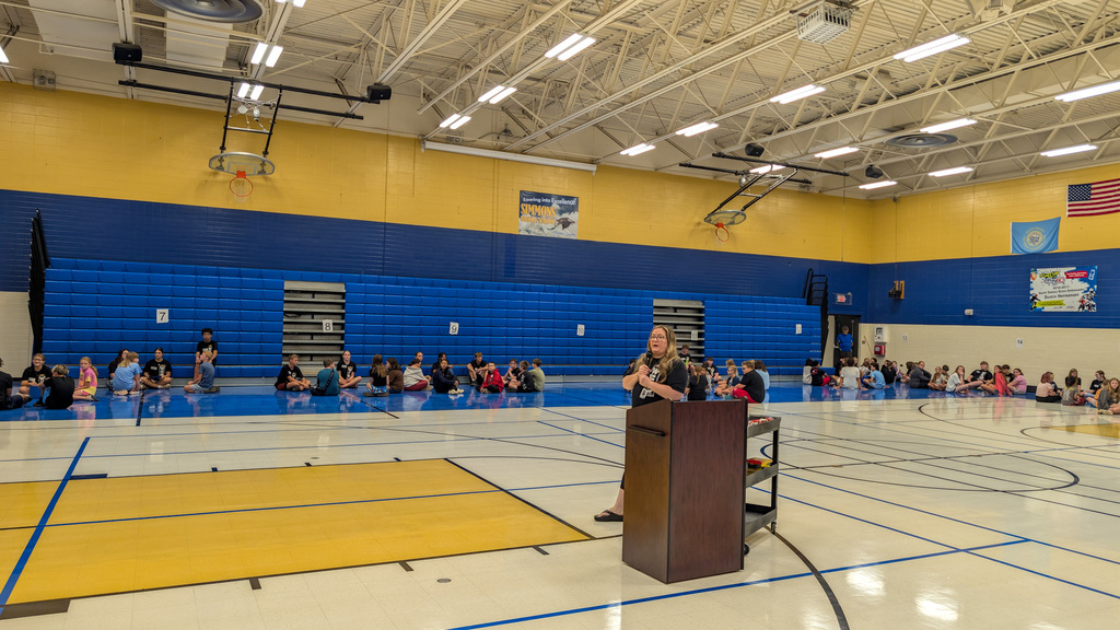Mrs. Samson talking to Simmons 6th graders and WEB leaders