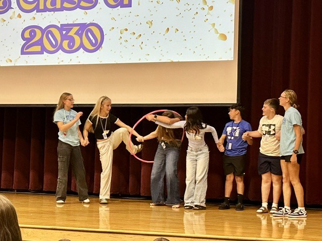 Eagle Squad members playing a game with freshmen