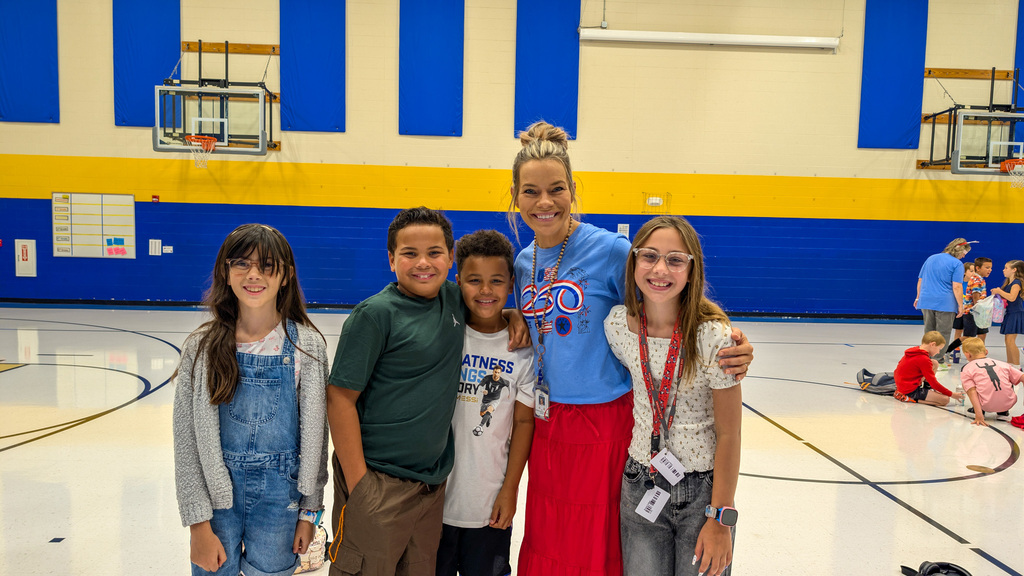 C.C. Lee students posing with a teacher wearing an America 250 shirt