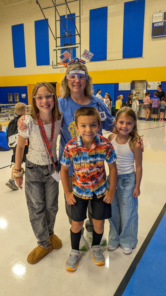 C.C. Lee students with a staff member wearing America 250 sunglasses and headband