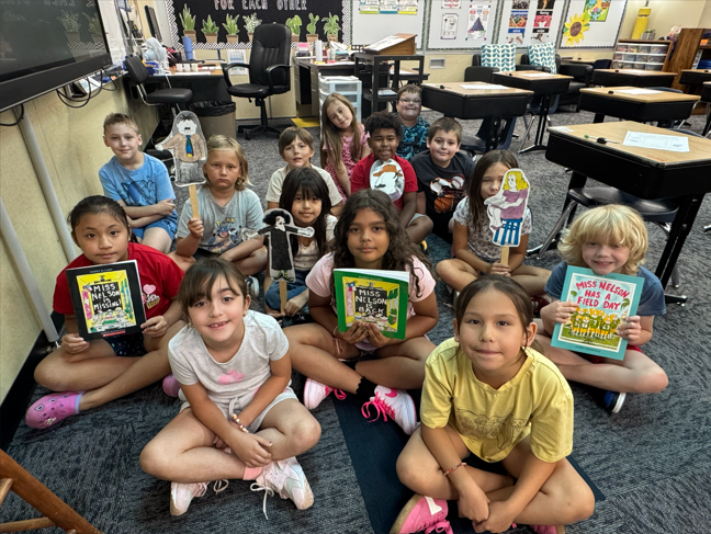 Students sitting with Miss Nelson is Missing Book