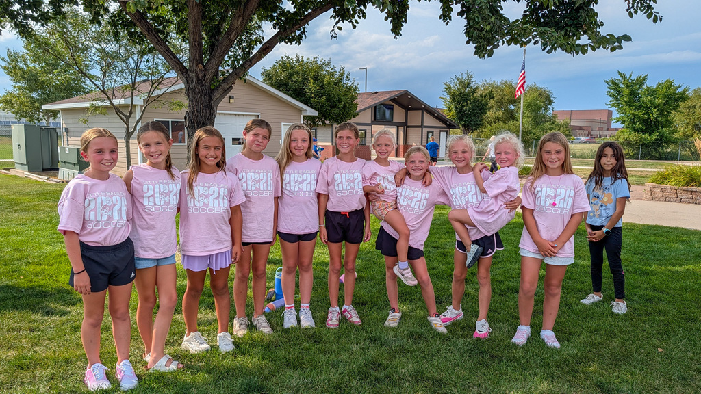 Group photo of youth soccer campers in their camp t-shirts