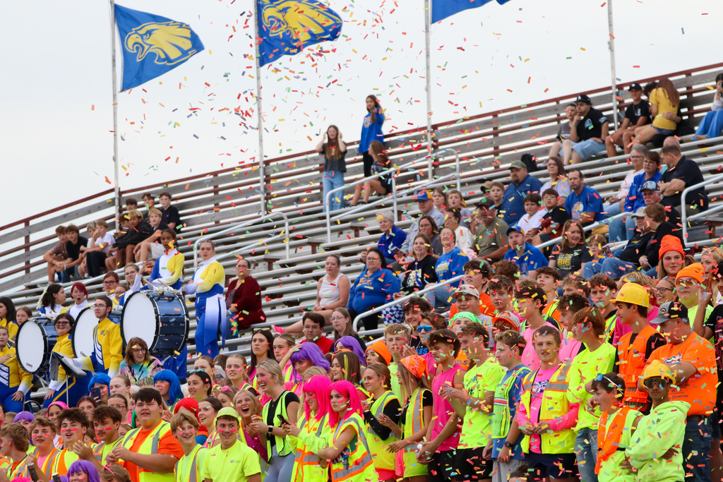 Confetti falling into the crowd in the student section