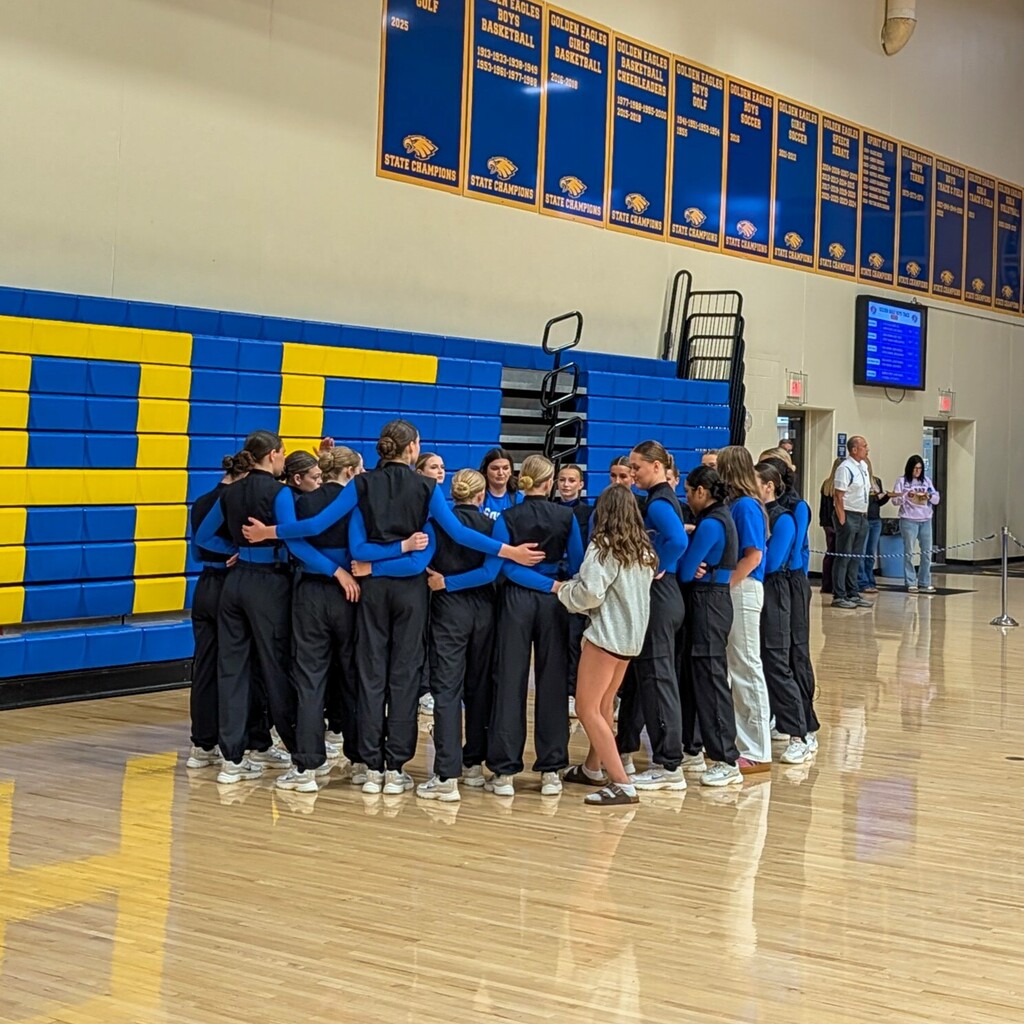 CHS dance team huddled before their performance