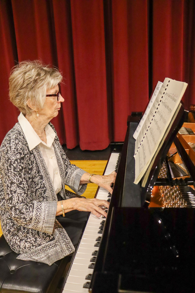 Sue Gates playing Central's brand new piano