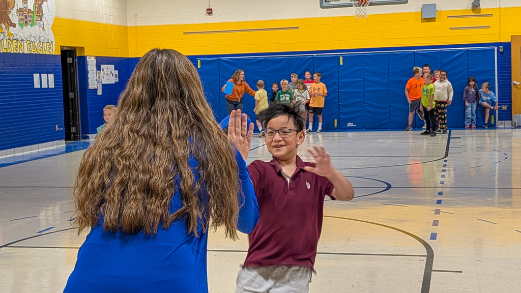May Overby student participating in a relay at the Homecoming Assembly