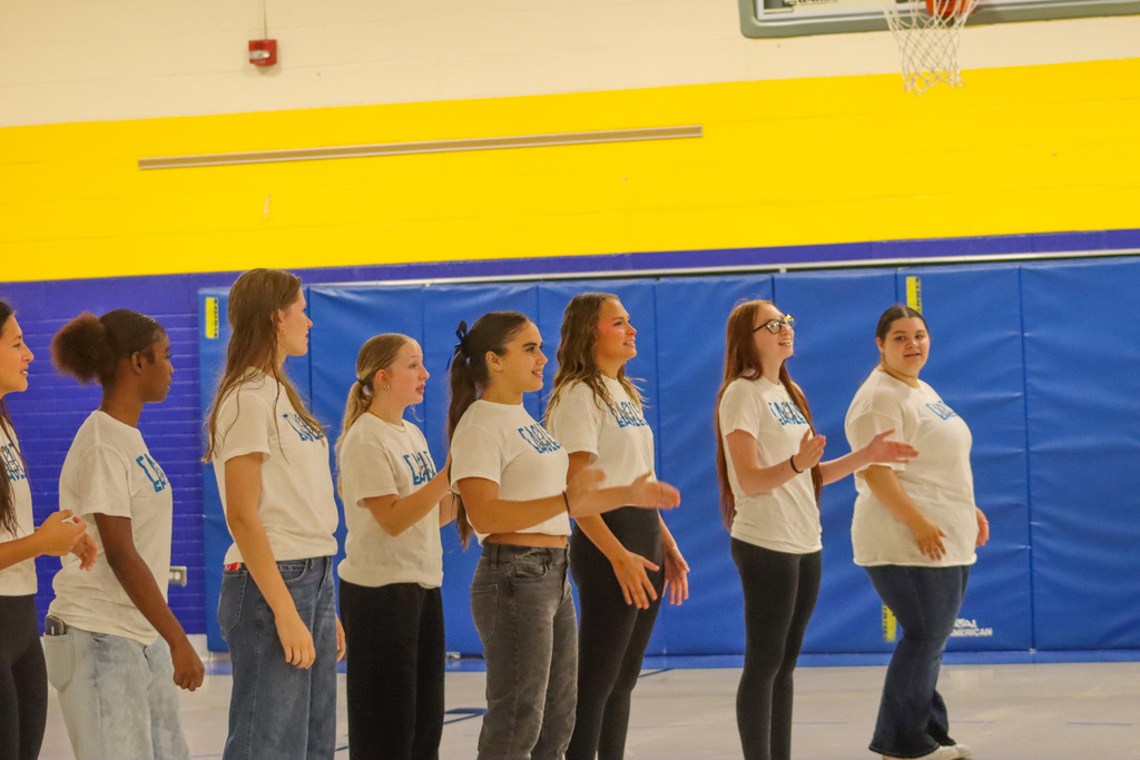 Golden Eagles cheer team members at the May Overby Homecoming Assembly