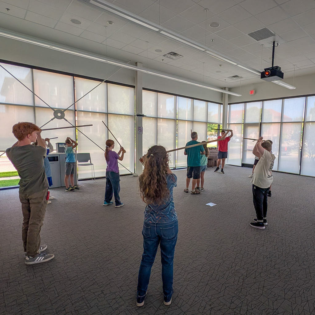 Students participating in the CHS stage combat workshop at the library