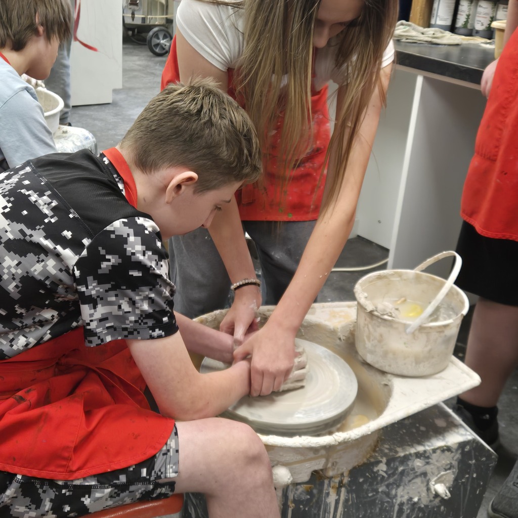 8th grade art is getting messy at Holgate! Students having a blast trying their hand at wheel-thrown pottery!