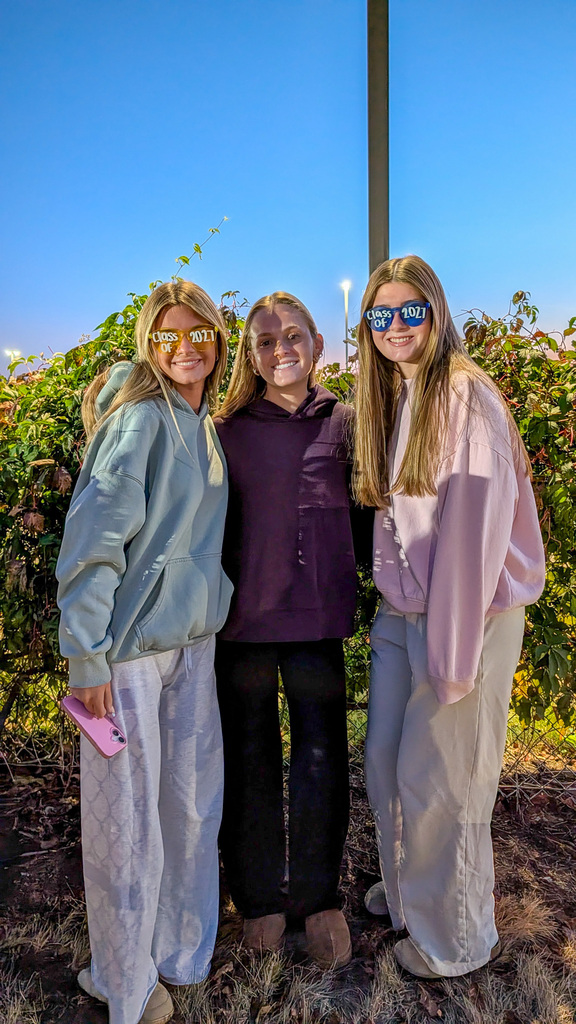 CHS seniors posing wearing class of 2027 sunglasses
