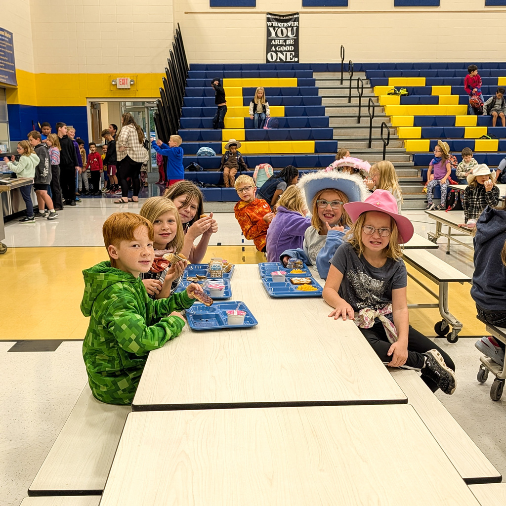 A group of Simmons Elementary students eating breakfast