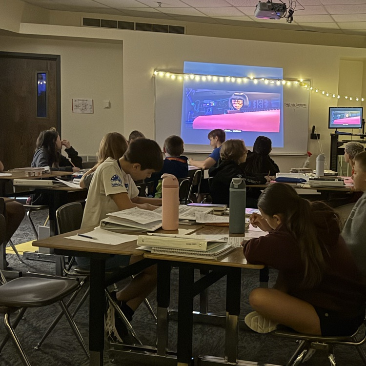 Students watching Pixar Shorts Films to practice plot elements.