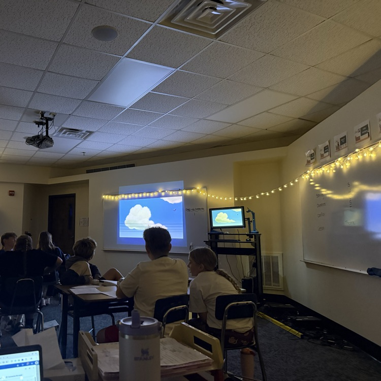 Students watching Pixar Short Films to practice plot elements.