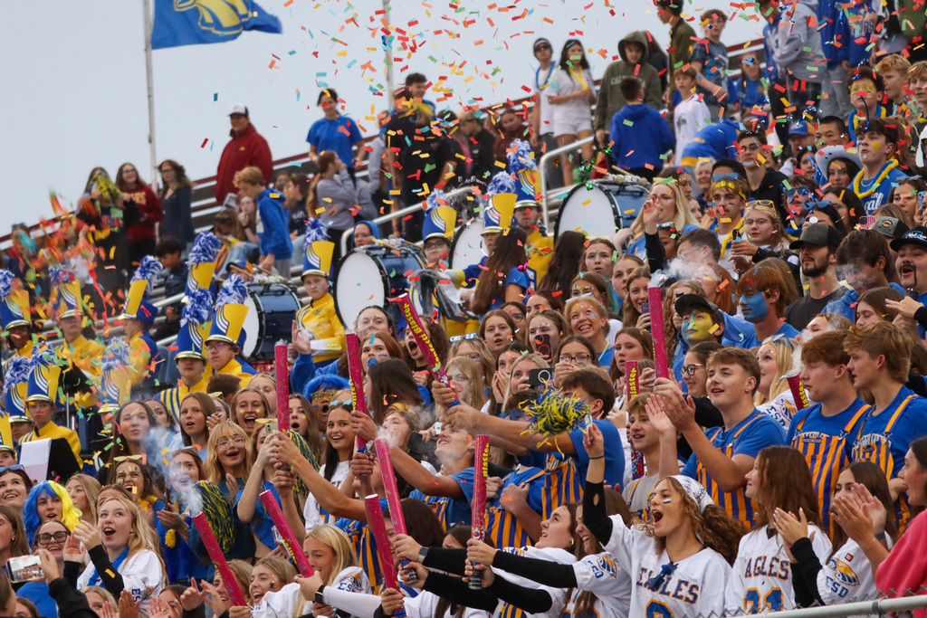 CHS students cheering and setting off confetti in the crowd