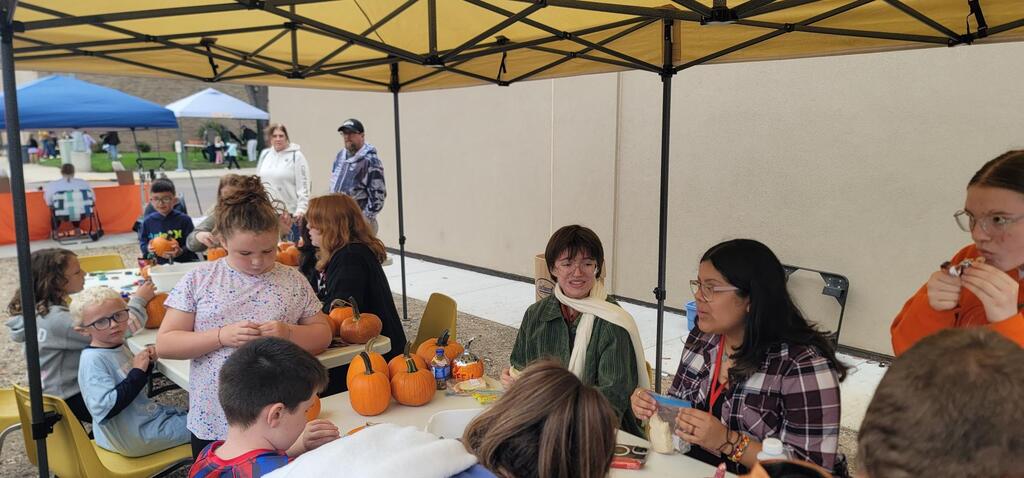 Emma B, Kaelyn B, and Jazmine R. helped out at the pumpkin decorating station at the Harvest Festival this weekend!