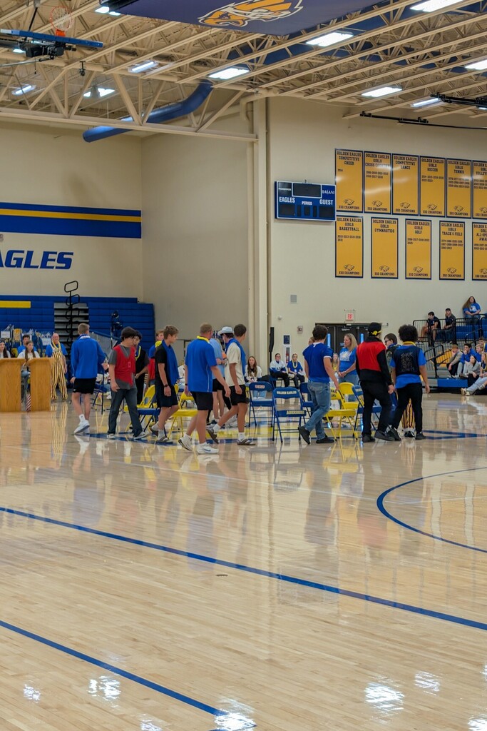 Students playing musical chairs at the pep rally