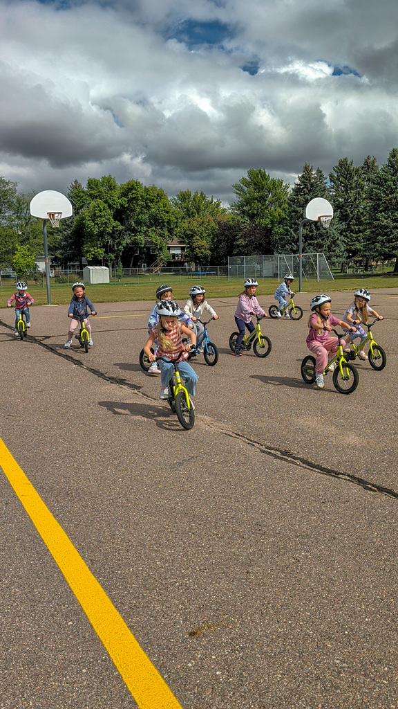 C.C. Lee students riding Strider bikes during gym class