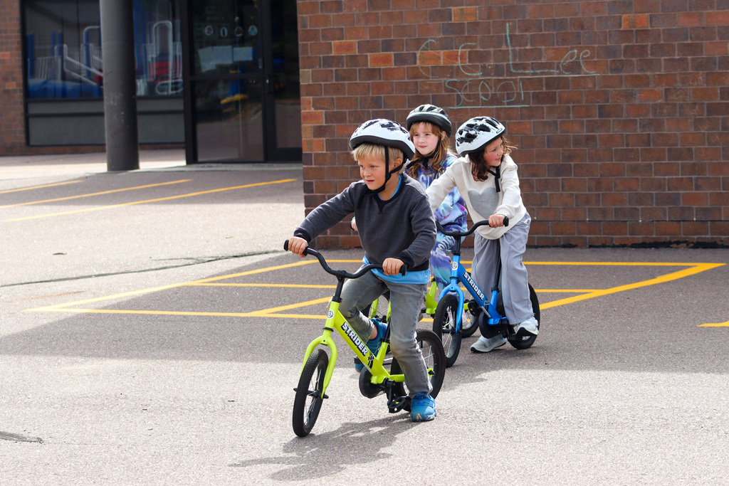 C.C. Lee students riding Strider bikes during gym class