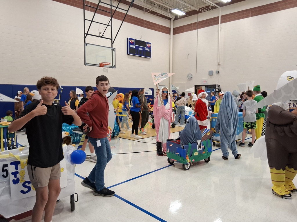 Student giving a thumbs up that they are ready for the parade.