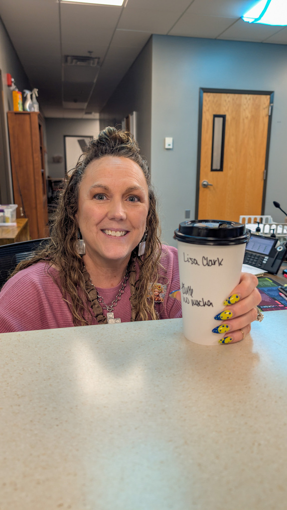 SMS staff member with coffee