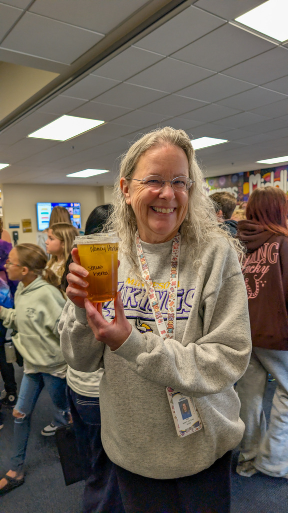 SMS staff member with her coffee