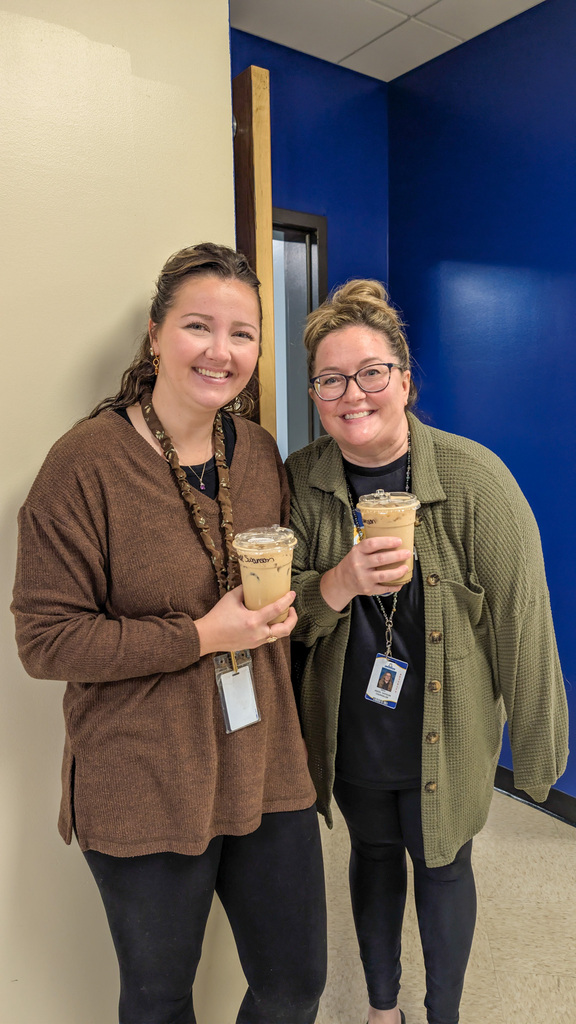 SMS staff members with coffee