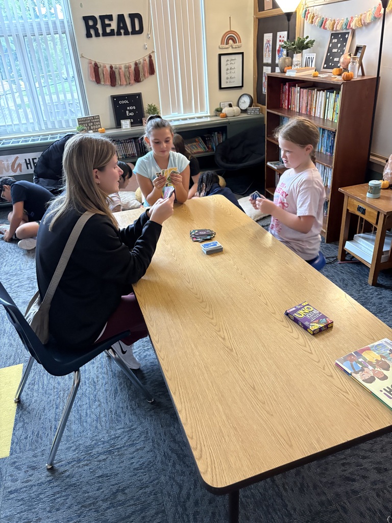 Students playing games with NSU volleyball player