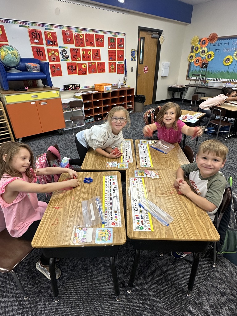 Kindergarten students playing with homemade playdough